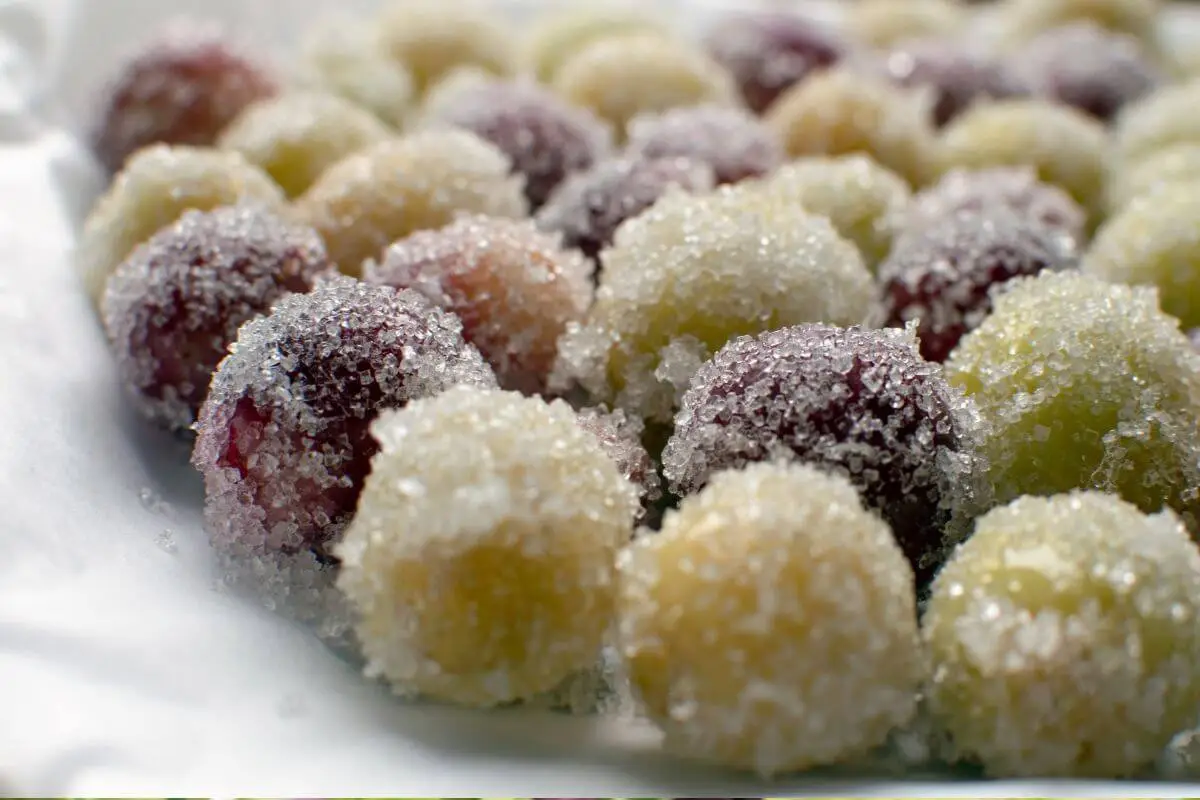 Close-up of assorted candied grapes with sugar crystals.