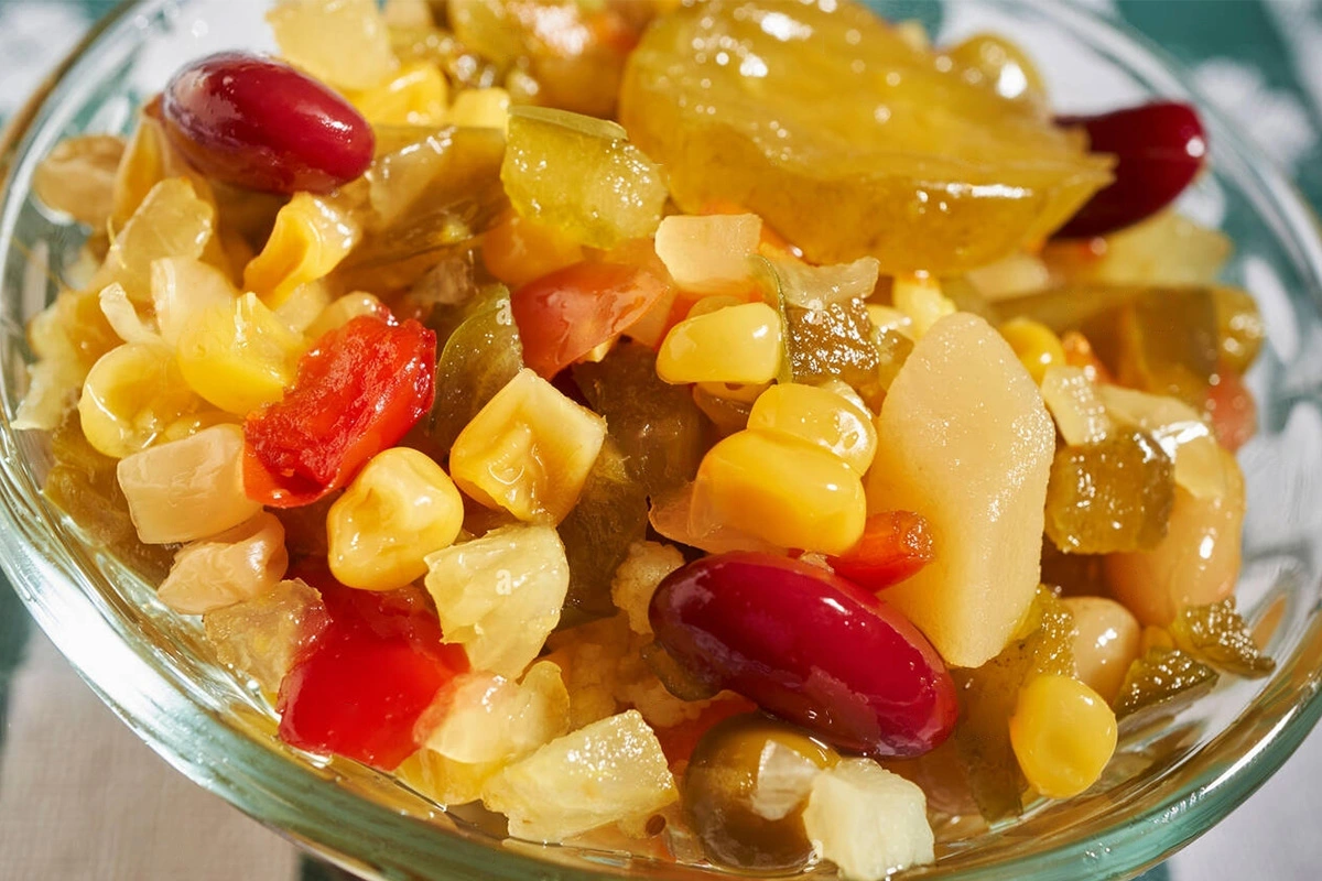 Close-up of chow chow relish showcasing its colorful ingredients in a glass dish