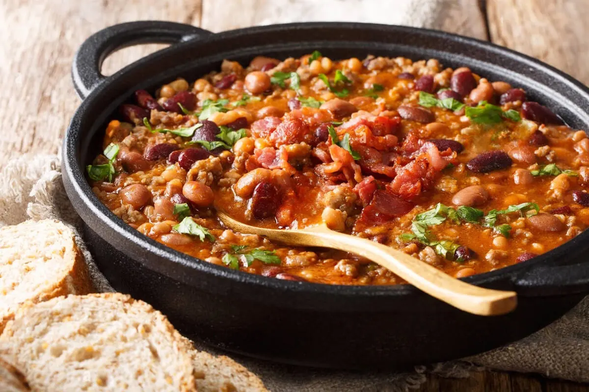 Close-up of cowboy bean soup in a cast iron skillet