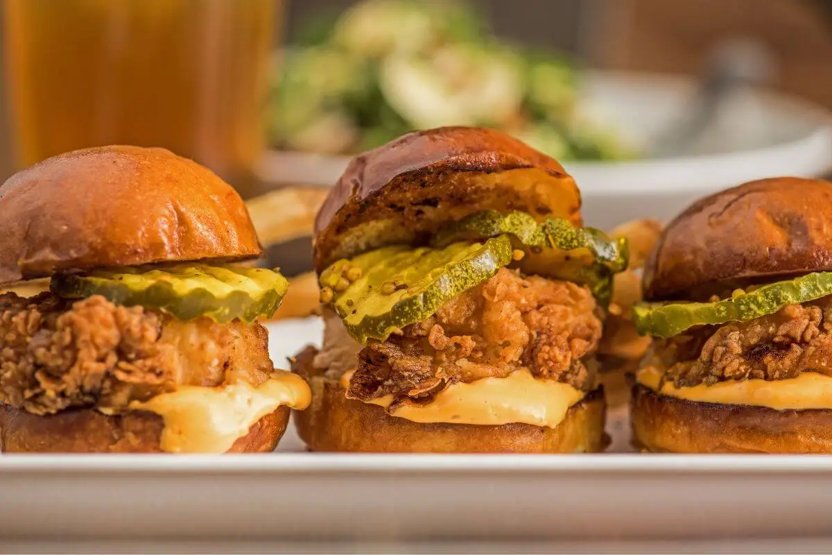 Crispy Fried Chicken Sliders with Melted Cheese and Pickles on Brioche Buns