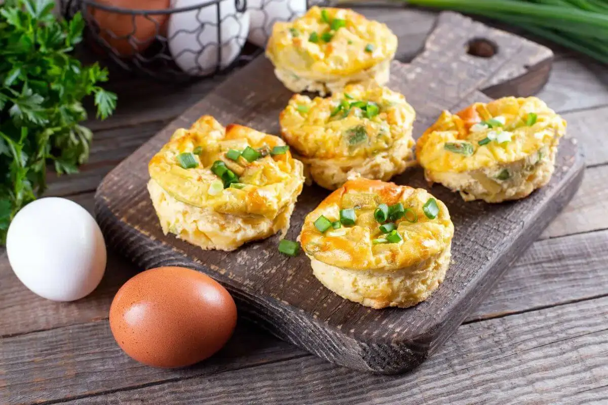 Egg white bites with spinach and feta cheese in a muffin tin, perfect for a healthy breakfast or snack.