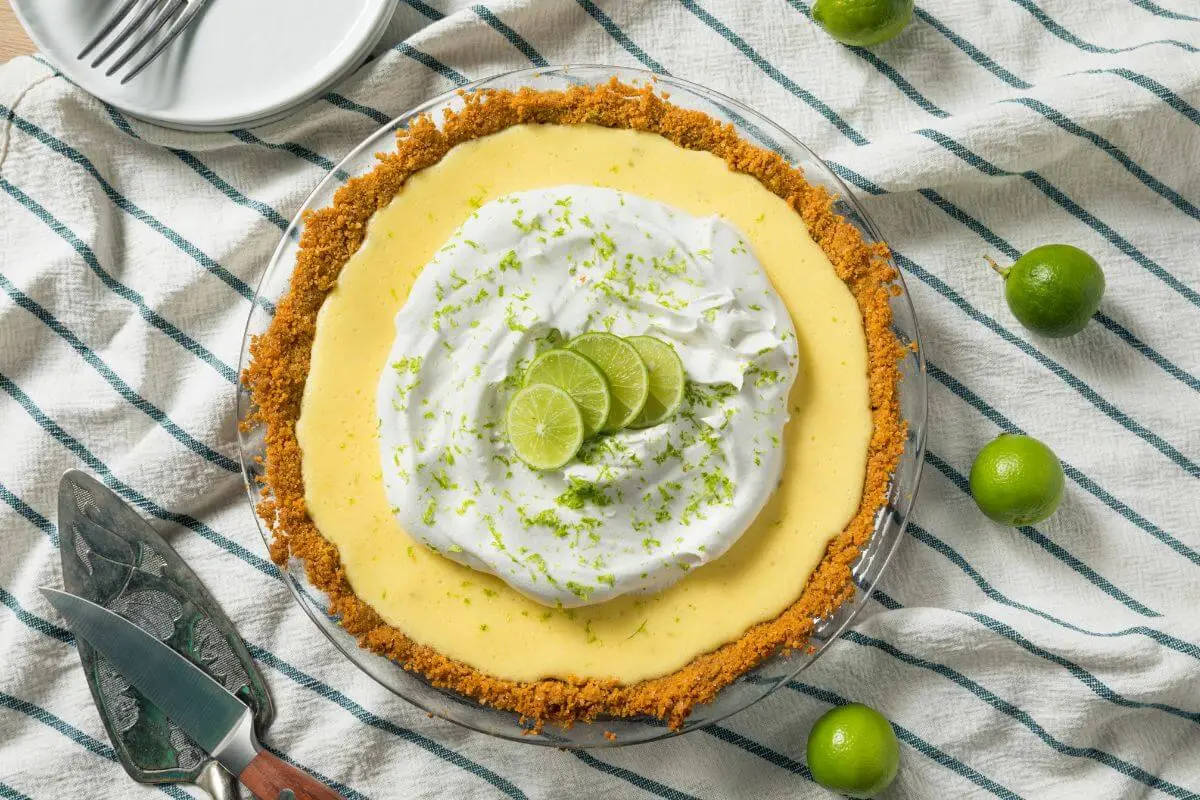 Key lime pie with whipped cream and lime zest