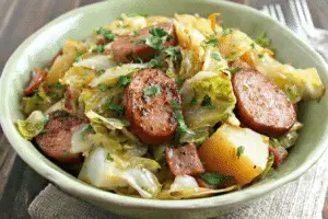 Braised Cabbage With Potatoes And Smoked Sausages